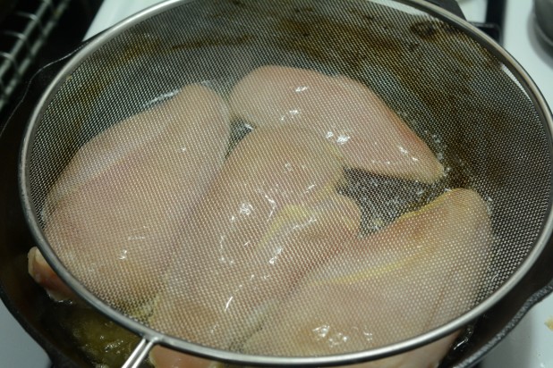 Frying Chicken with Splatter Shield