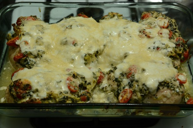 Finished Chicken Stuffed and Topped with Spinach Artichoke Dip