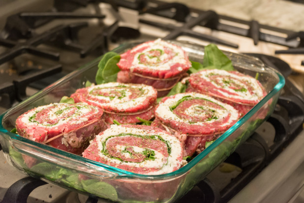 Flank Steak Pinwheels on Spinach Bed