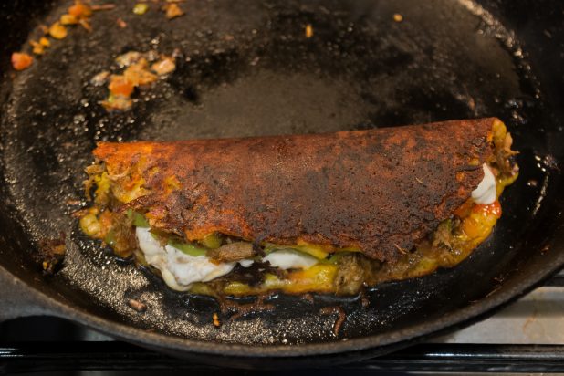 Cheese Crusted Pork Carnitas Taco on Cast Iron